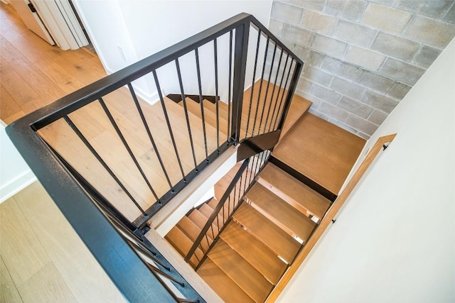 700 Denson Dr Unit 1104, Austin, TX 78752 - stairway featuring wood finished floors
