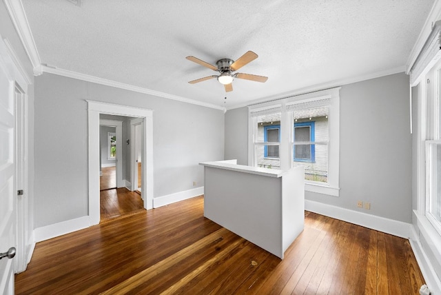 2032 E Cesar Chavez St, Austin, TX 78702 - empty room with dark wood-style floors, a ceiling fan, baseboards, a textured ceiling, and ornamental molding