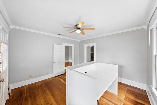 2032 E Cesar Chavez St, Austin, TX 78702 - empty room featuring crown molding, wood finished floors, a ceiling fan, and baseboards