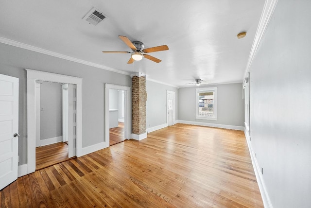 2032 E Cesar Chavez St, Austin, TX 78702 - unfurnished living room with a ceiling fan, crown molding, light wood-type flooring, and baseboards