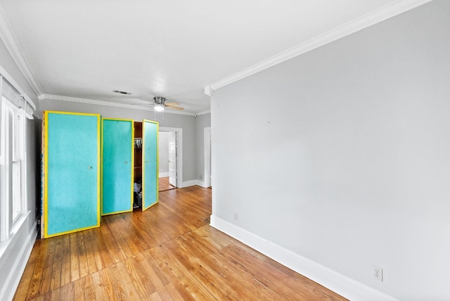 2032 E Cesar Chavez St, Austin, TX 78702 - unfurnished room with wood-type flooring, baseboards, ornamental molding, and a ceiling fan
