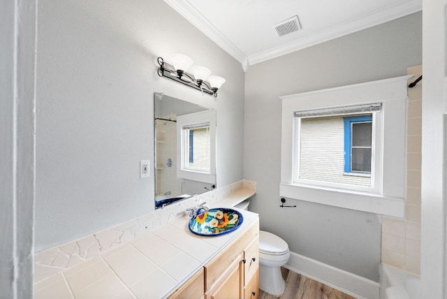 2032 E Cesar Chavez St, Austin, TX 78702 - full bathroom featuring ornamental molding, toilet, wood finished floors, vanity, and baseboards