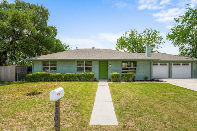 304 W Bee St, Lockhart, TX 78644 - ranch-style home with an attached garage, concrete driveway, brick siding, a chimney, and roof with shingles