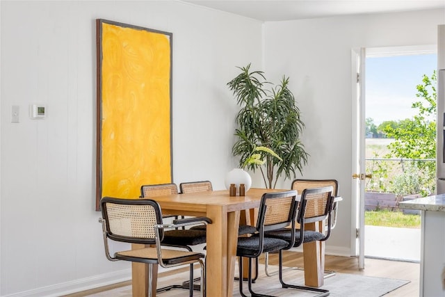 304 W Bee St, Lockhart, TX 78644 - dining room with plenty of natural light, baseboards, and light wood-style floors