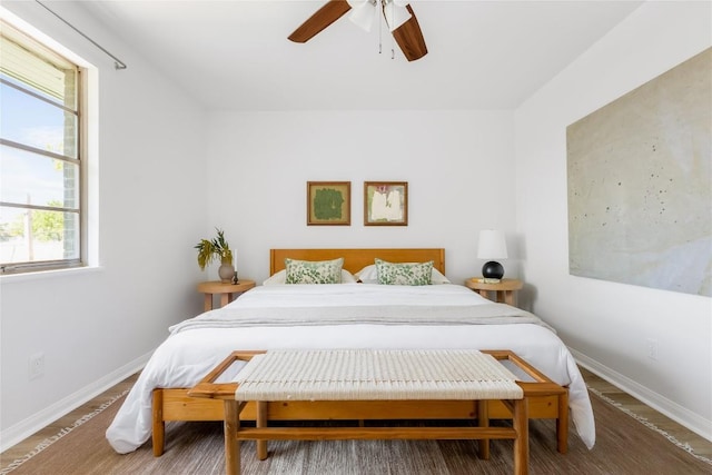 304 W Bee St, Lockhart, TX 78644 - bedroom with baseboards, multiple windows, and ceiling fan