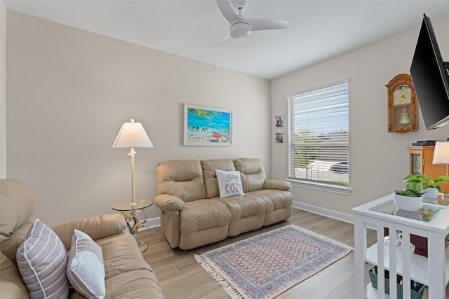 3227 Drago Dr, Round Rock, TX 78665 - living area featuring ceiling fan, baseboards, and light wood-style flooring