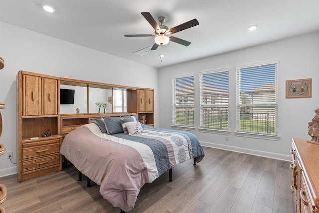 3227 Drago Dr, Round Rock, TX 78665 - bedroom featuring multiple windows, wood finished floors, baseboards, and recessed lighting
