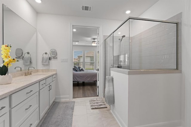 3227 Drago Dr, Round Rock, TX 78665 - bathroom with ensuite bathroom, vanity, tiled shower, ceiling fan, and recessed lighting