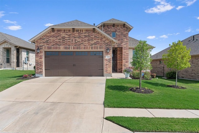 3227 Drago Dr, Round Rock, TX 78665 - view of front of house with brick siding, an attached garage, and a front lawn