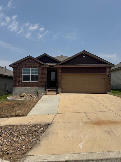 5511 Toledo Farm, San Antonio, TX 78222 - single story home featuring brick siding, an attached garage, and concrete driveway
