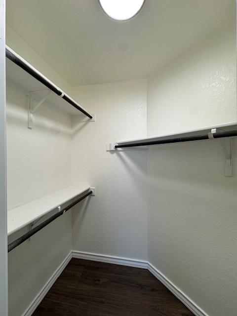 5511 Toledo Farm, San Antonio, TX 78222 - spacious closet featuring dark wood-style flooring