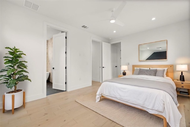 1711 E M Franklin Ave Unit 1, Austin, TX 78721 - bedroom featuring light wood-type flooring, recessed lighting, baseboards, ceiling fan, and ensuite bathroom