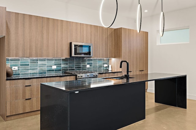 1711 E M Franklin Ave Unit 1, Austin, TX 78721 - kitchen featuring modern cabinets, a sink, stainless steel microwave, and dark countertops