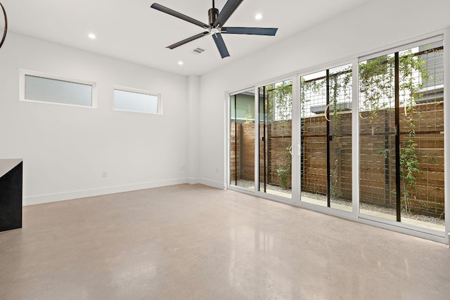 1711 E M Franklin Ave Unit 1, Austin, TX 78721 - empty room featuring concrete flooring, healthy amount of natural light, recessed lighting, a ceiling fan, and baseboards