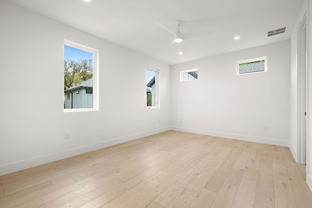 1711 E M Franklin Ave Unit 1, Austin, TX 78721 - empty room featuring healthy amount of natural light, baseboards, recessed lighting, ceiling fan, and light wood finished floors