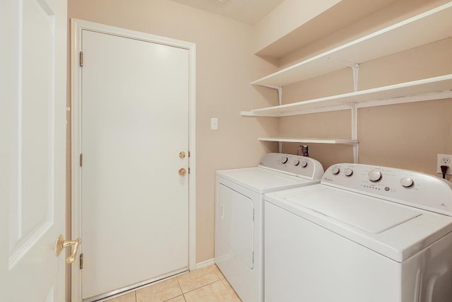 13413 Bolivia Dr, Austin, TX 78729 - laundry area with separate washer and dryer and light tile patterned floors