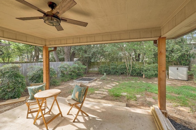13413 Bolivia Dr, Austin, TX 78729 - fenced backyard featuring a patio and a ceiling fan