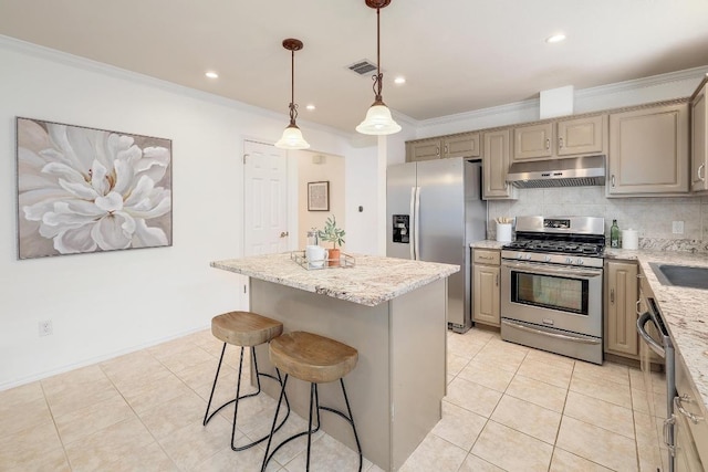 13413 Bolivia Dr, Austin, TX 78729 - kitchen featuring stainless steel appliances, under cabinet range hood, crown molding, a kitchen island, and backsplash