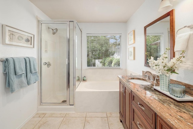 13413 Bolivia Dr, Austin, TX 78729 - bathroom with a shower stall, a garden tub, vanity, and tile patterned flooring