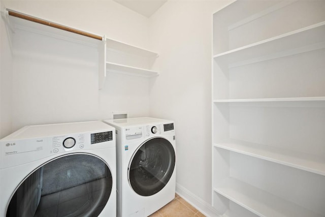 206 Skinner, Kyle, TX 78640 - washroom featuring independent washer and dryer, light tile patterned flooring, and baseboards