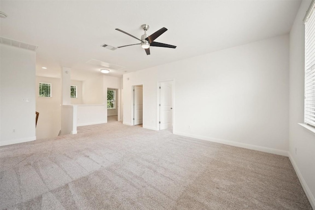 206 Skinner, Kyle, TX 78640 - unfurnished room featuring ceiling fan, light colored carpet, and baseboards