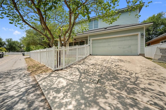 206 Skinner, Kyle, TX 78640 - view of front of home featuring a garage and driveway