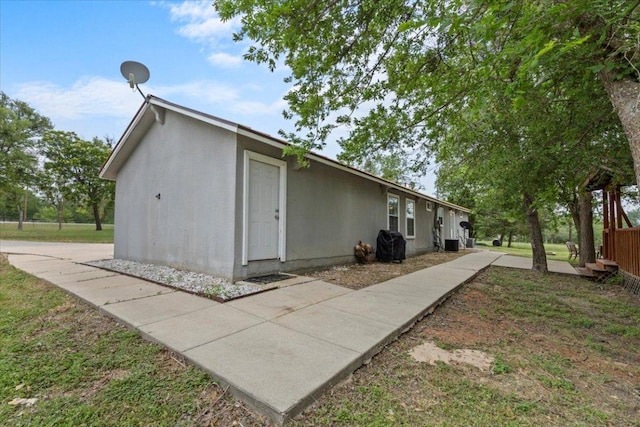 7406 Nez Perce Trce, Manor, TX 78653 - view of property exterior featuring stucco siding