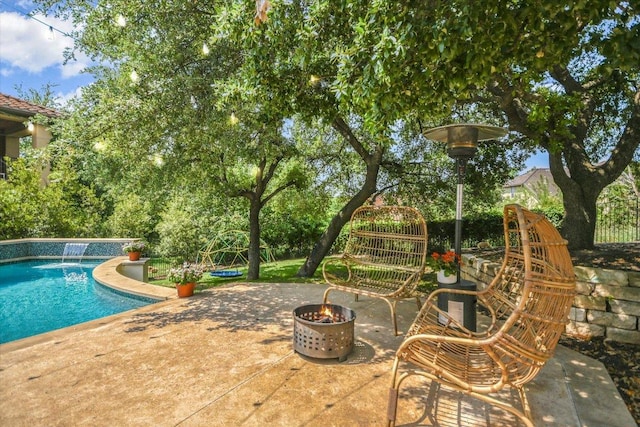 11316 Woodland Hills Trl, Austin, TX 78732 - outdoor pool featuring an outdoor fire pit and a patio