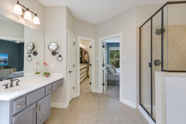 11316 Woodland Hills Trl, Austin, TX 78732 - bathroom with ensuite bath, baseboards, a stall shower, and tile patterned floors