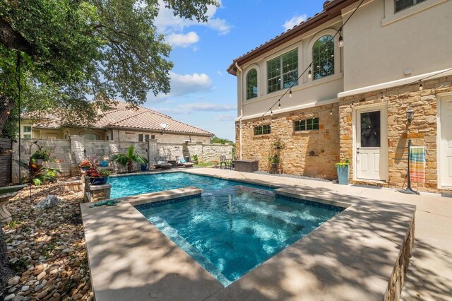 7 Sunview Rd, The Hills, TX 78738 - view of pool featuring a pool with connected hot tub and a patio area