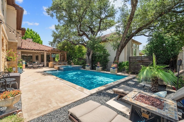7 Sunview Rd, The Hills, TX 78738 - view of pool featuring a fire pit, a patio area, and a pool with connected hot tub