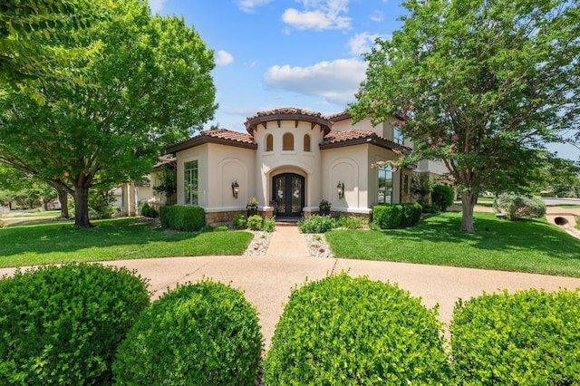 7 Sunview Rd, The Hills, TX 78738 - mediterranean / spanish-style home with french doors, stucco siding, a tiled roof, and a front yard
