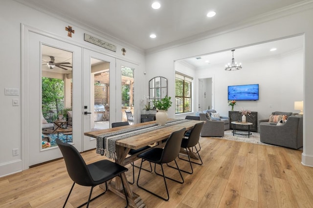 7 Sunview Rd, The Hills, TX 78738 - dining room featuring plenty of natural light, light wood finished floors, ornamental molding, recessed lighting, and a chandelier