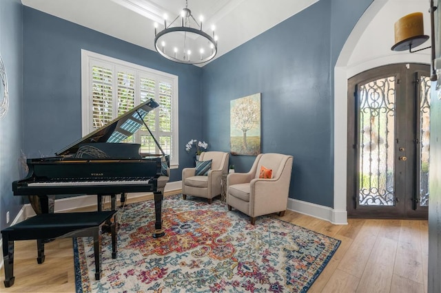 7 Sunview Rd, The Hills, TX 78738 - foyer entrance featuring a chandelier, wood finished floors, baseboards, and arched walkways