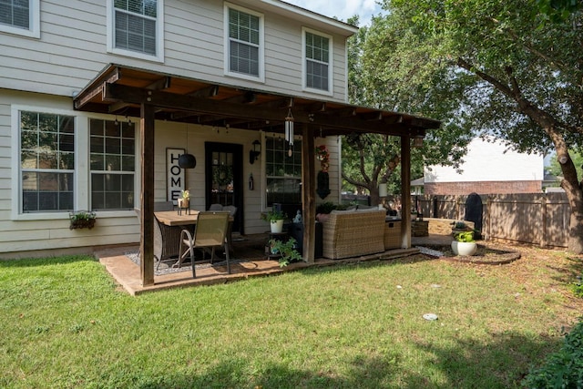 832 Hometown Pkwy, Kyle, TX 78640 - rear view of property with a patio area and an outdoor living space
