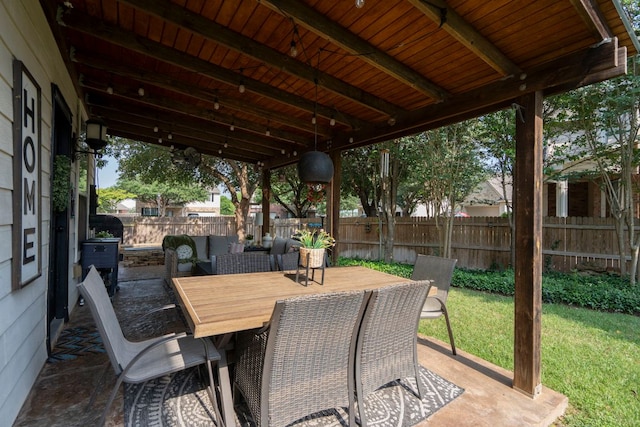 832 Hometown Pkwy, Kyle, TX 78640 - fenced backyard with a patio and outdoor dining area