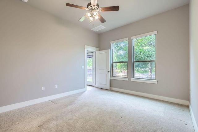 13001 Hymeadow Dr Unit 18, Austin, TX 78729 - spare room featuring baseboards, carpet floors, and a ceiling fan