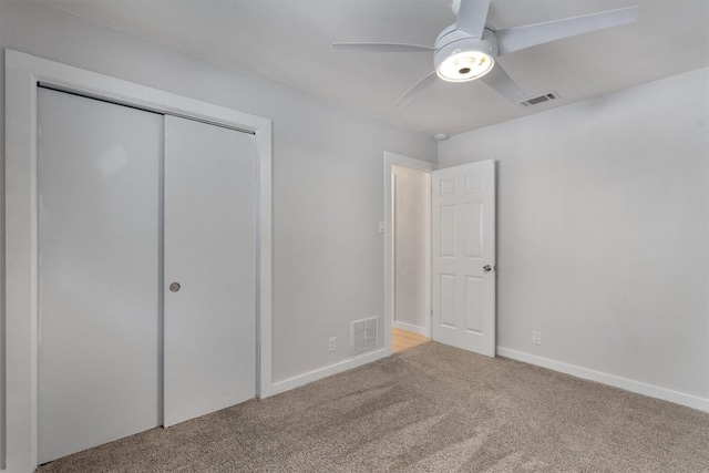 902 Acorn Oaks Dr, Austin, TX 78745 - unfurnished bedroom featuring carpet floors, a closet, and a ceiling fan