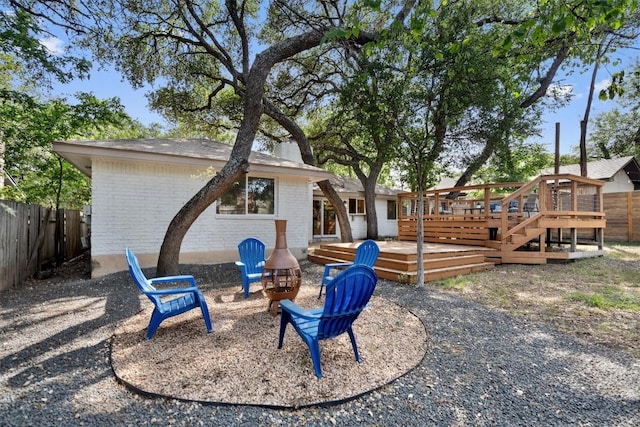 902 Acorn Oaks Dr, Austin, TX 78745 - back of house featuring a wooden deck and brick siding