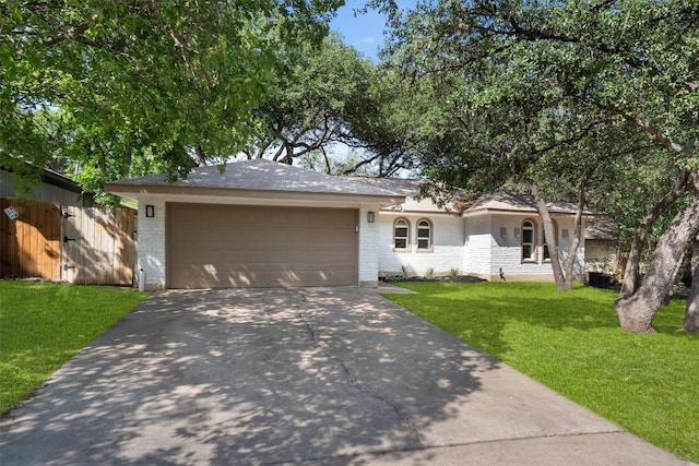 902 Acorn Oaks Dr, Austin, TX 78745 - ranch-style house with driveway, a garage, and brick siding