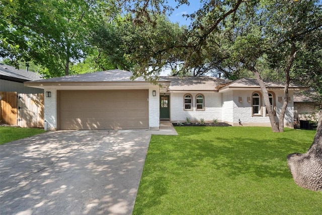 902 Acorn Oaks Dr, Austin, TX 78745 - ranch-style house featuring a garage, driveway, brick siding, and a front yard
