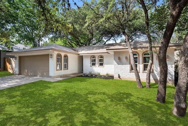 902 Acorn Oaks Dr, Austin, TX 78745 - single story home featuring a garage, brick siding, driveway, and a front yard