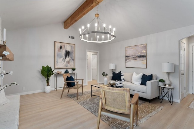 902 Acorn Oaks Dr, Austin, TX 78745 - living room featuring light wood-type flooring, a chandelier, and arched walkways