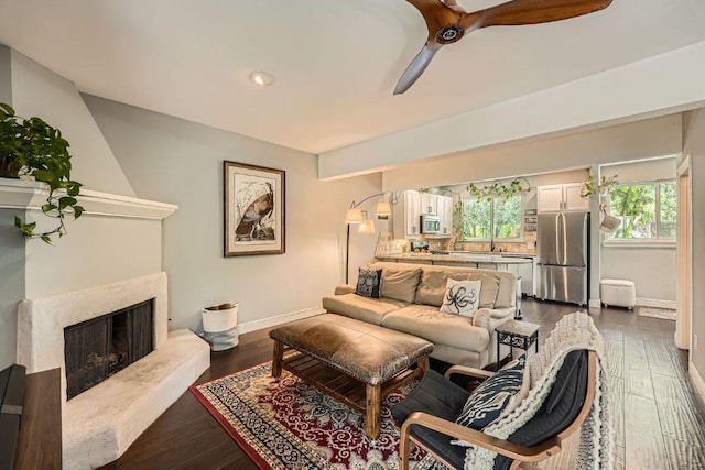 606 W Lynn St Unit 16, Austin, TX 78703 - living room with baseboards, dark wood-style floors, a ceiling fan, a premium fireplace, and recessed lighting