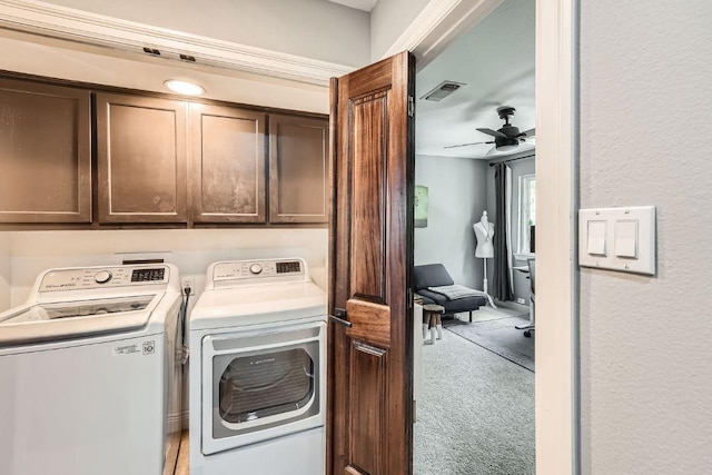 606 W Lynn St Unit 16, Austin, TX 78703 - laundry room with washing machine and clothes dryer, cabinet space, light carpet, and a ceiling fan
