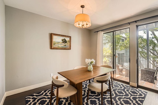 606 W Lynn St Unit 16, Austin, TX 78703 - dining space with baseboards and wood finished floors