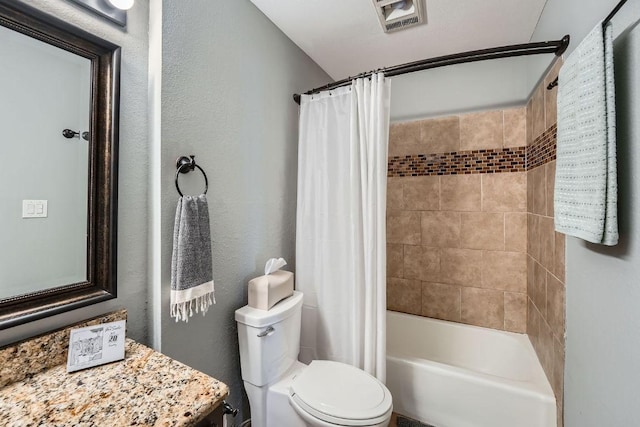 606 W Lynn St Unit 16, Austin, TX 78703 - bathroom with toilet, shower / tub combo with curtain, vanity, and a textured wall