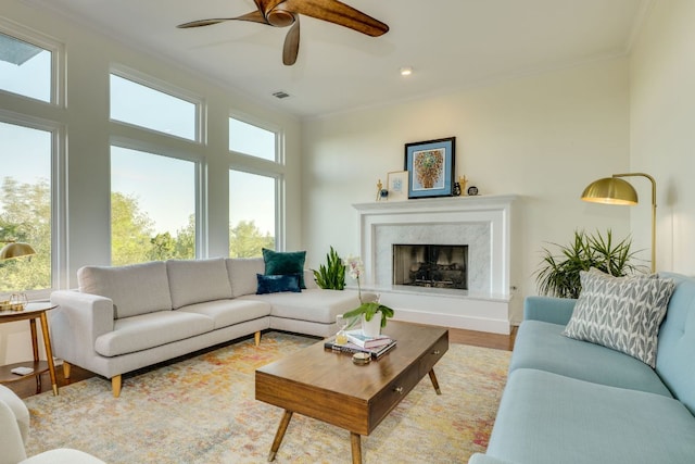 5801 Fox Chapel Dr, Austin, TX 78746 - living area featuring crown molding, a ceiling fan, wood finished floors, a fireplace, and recessed lighting