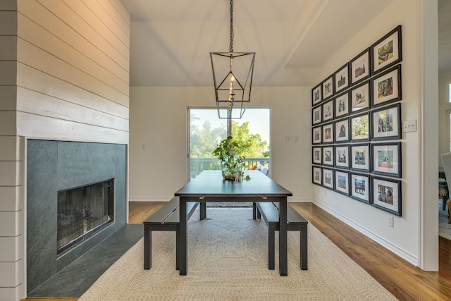 5801 Fox Chapel Dr, Austin, TX 78746 - dining space featuring dark wood finished floors, a large fireplace, and baseboards