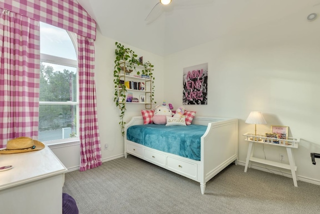 5801 Fox Chapel Dr, Austin, TX 78746 - carpeted bedroom with multiple windows, vaulted ceiling, ceiling fan, and baseboards